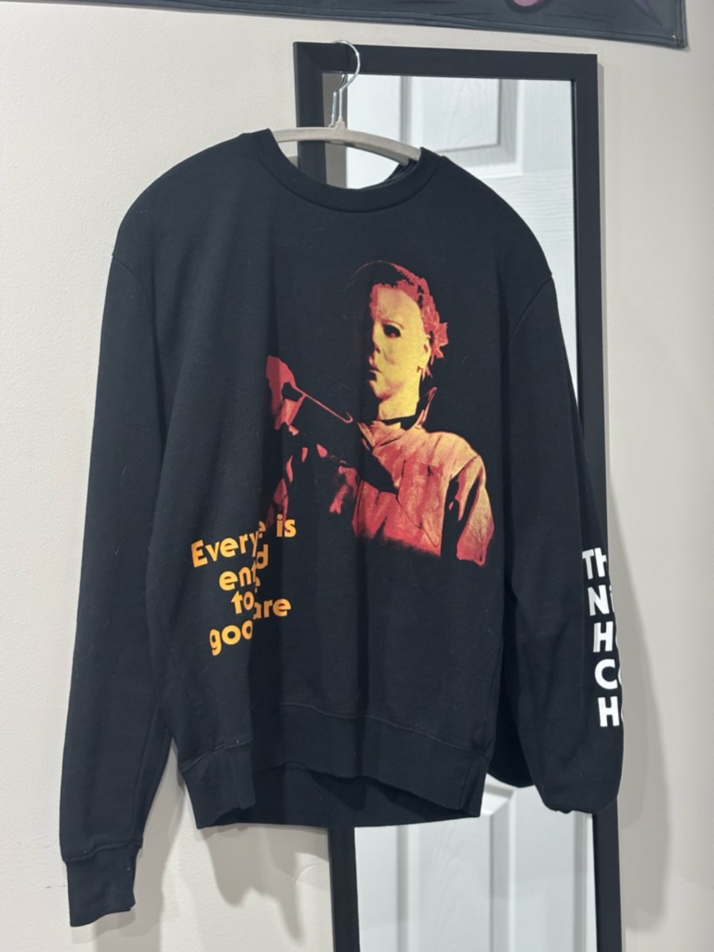 Spirit Black Crewneck Sweater with Orange and Red Graphic